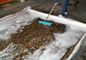 Fine rug being washed using the immersion cleaning process