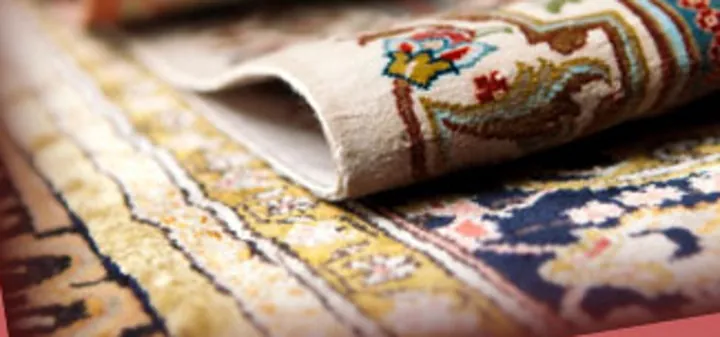 Close-up of the patterned Oriental rugs featured in Florida Rug Washing’s original banner